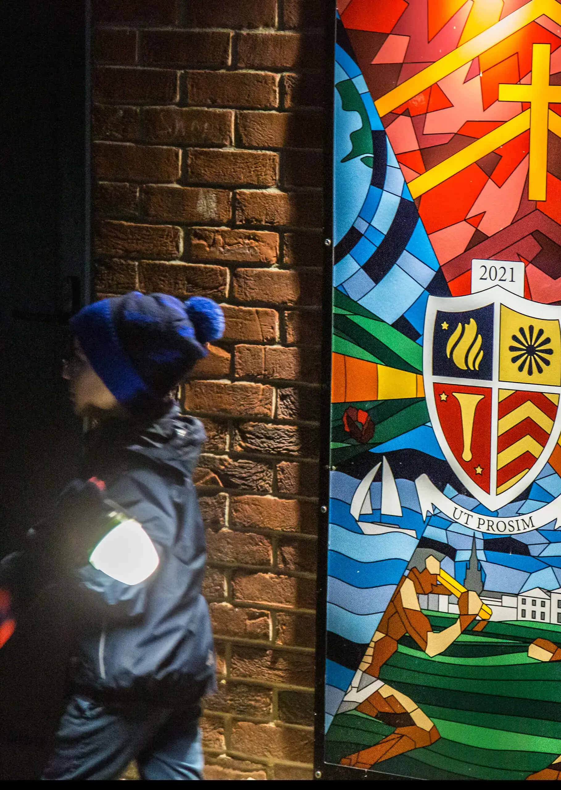 Ryde School Prep Pupils walking by plaque with Ryde School Crest