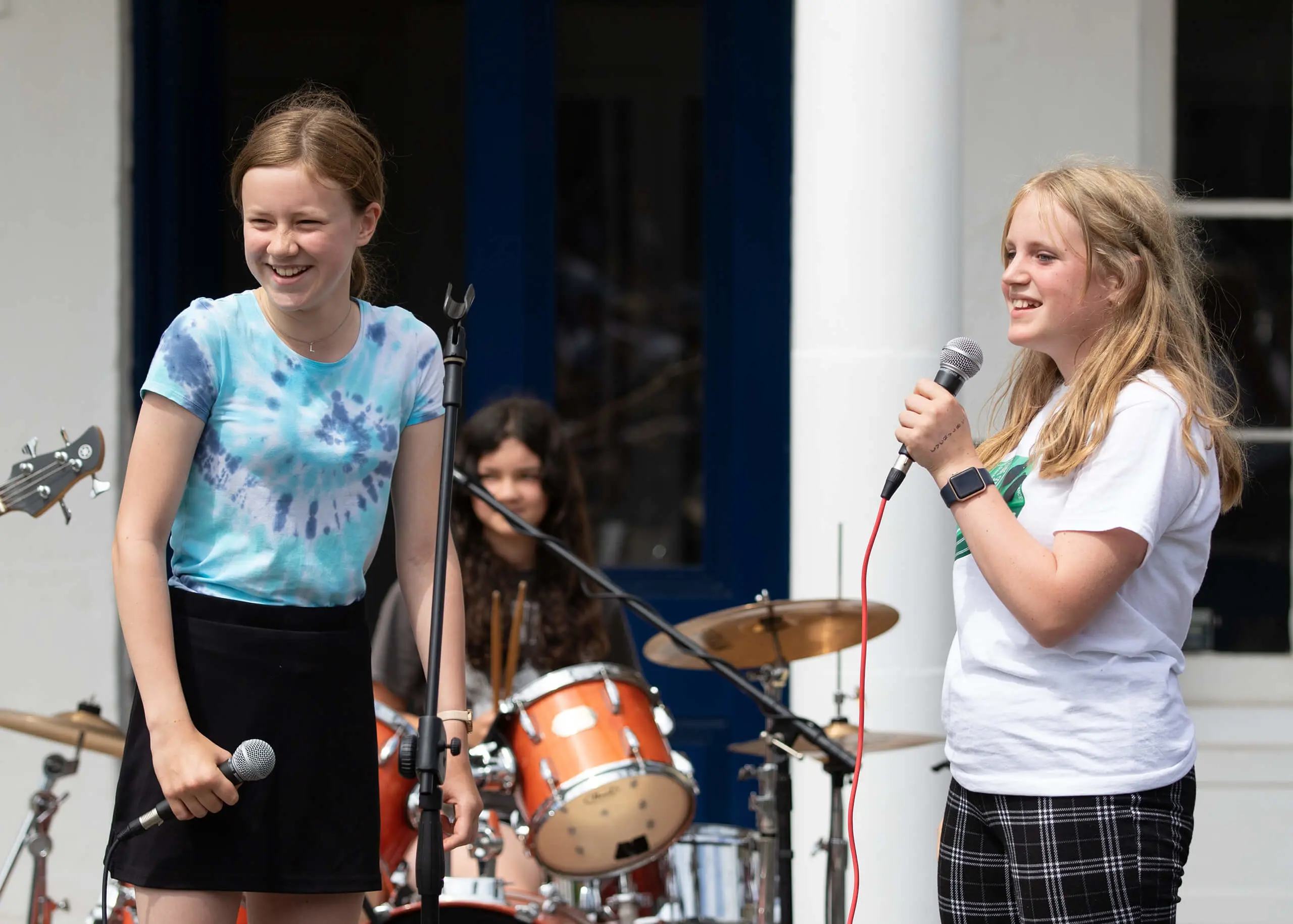 Ryde School Senior pupils singing in a band outside