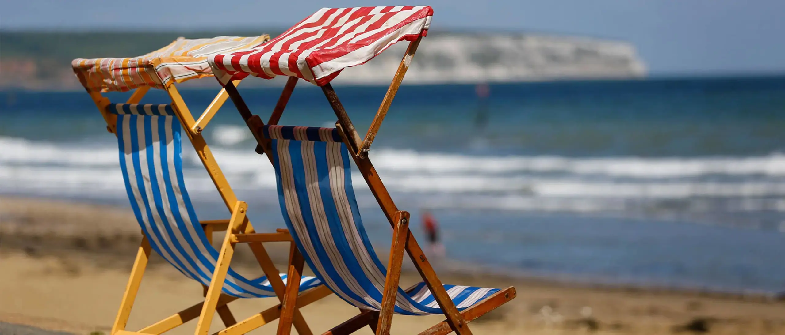 Two deck chairs on Isle of Wight beach