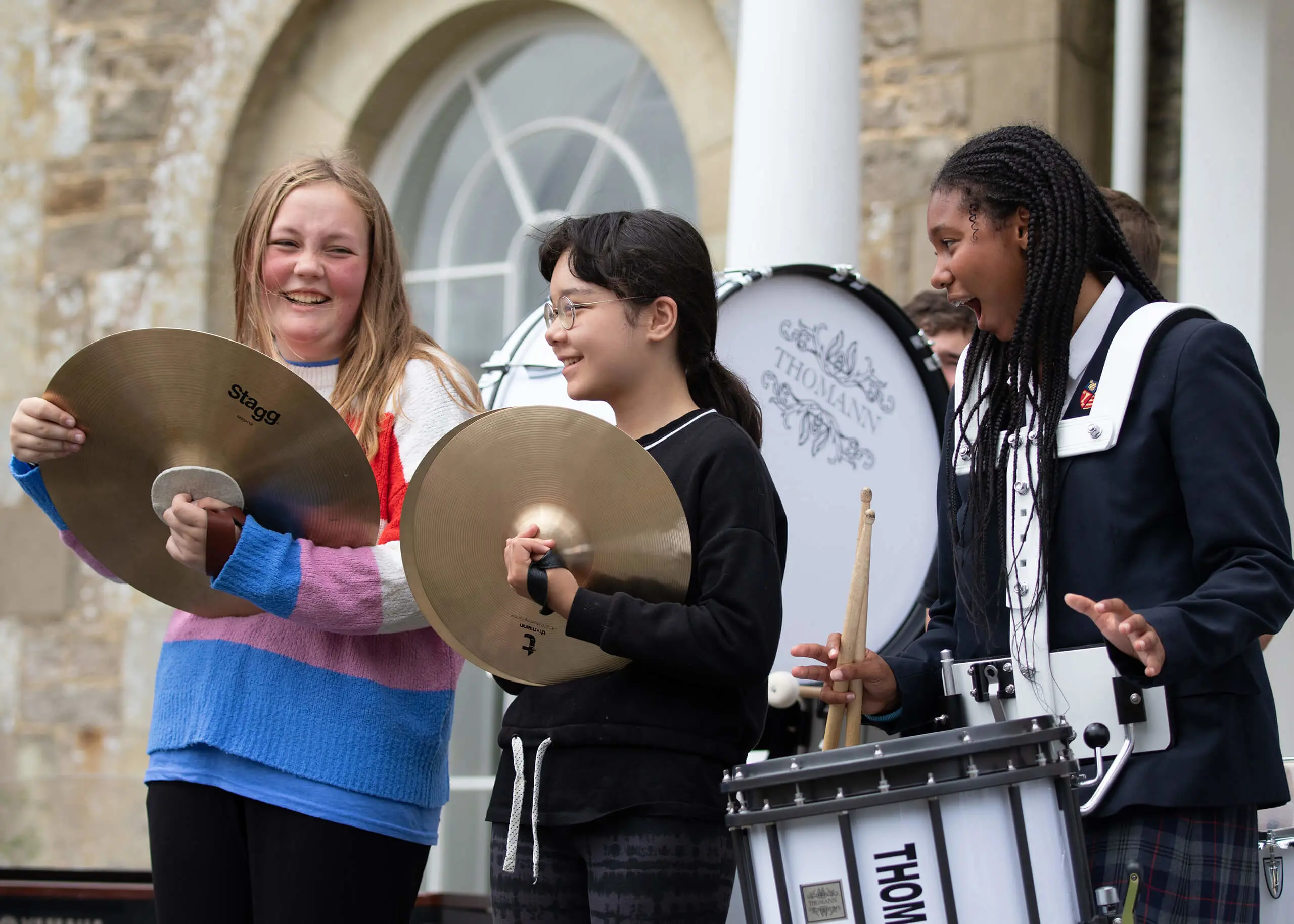 Ryde School Senior pupils performing in a band, holding cymbals