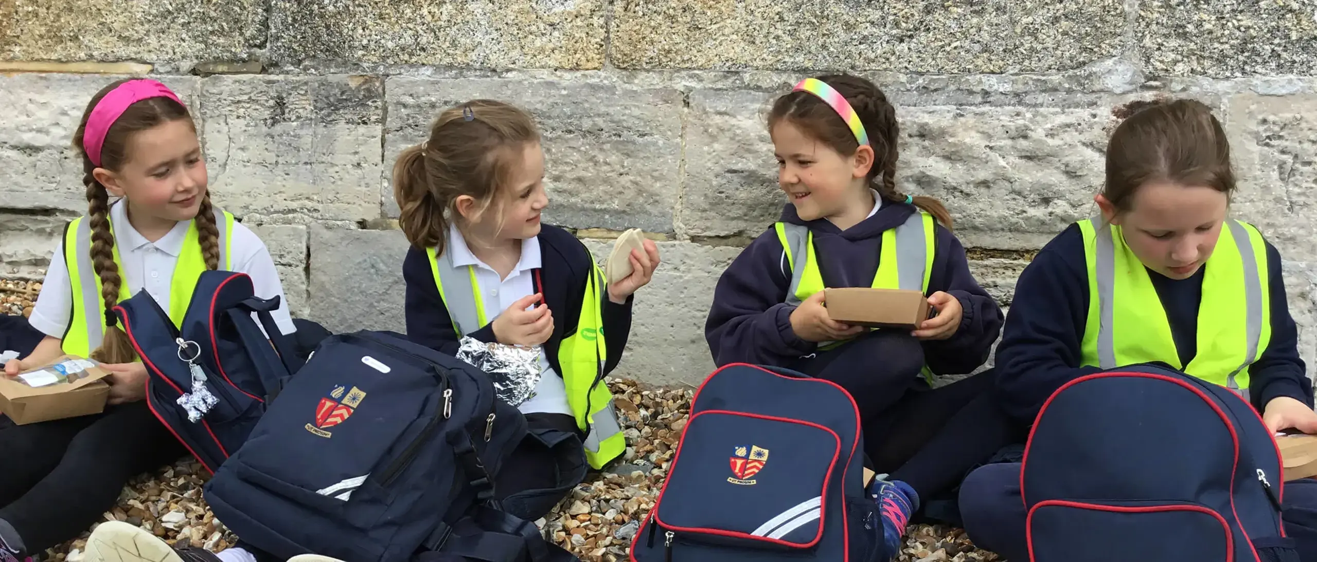 Ryde School Pre-Prep pupils eating lunch on the beach.